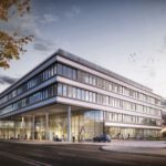 Moderne Bürogebäude-Architektur bei Sonnenuntergang mit Menschen und Autos im Vordergrund.