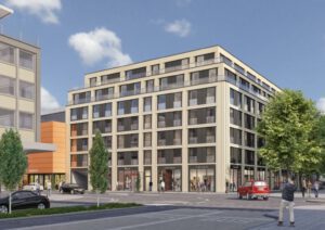 Moderne Wohn- und Geschäftshausfassade im Stadtzentrum, belebte Fußgängerzone und Autos, blauer Himmel.